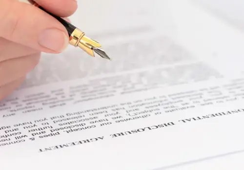 A person reviews a confidentiality agreement.